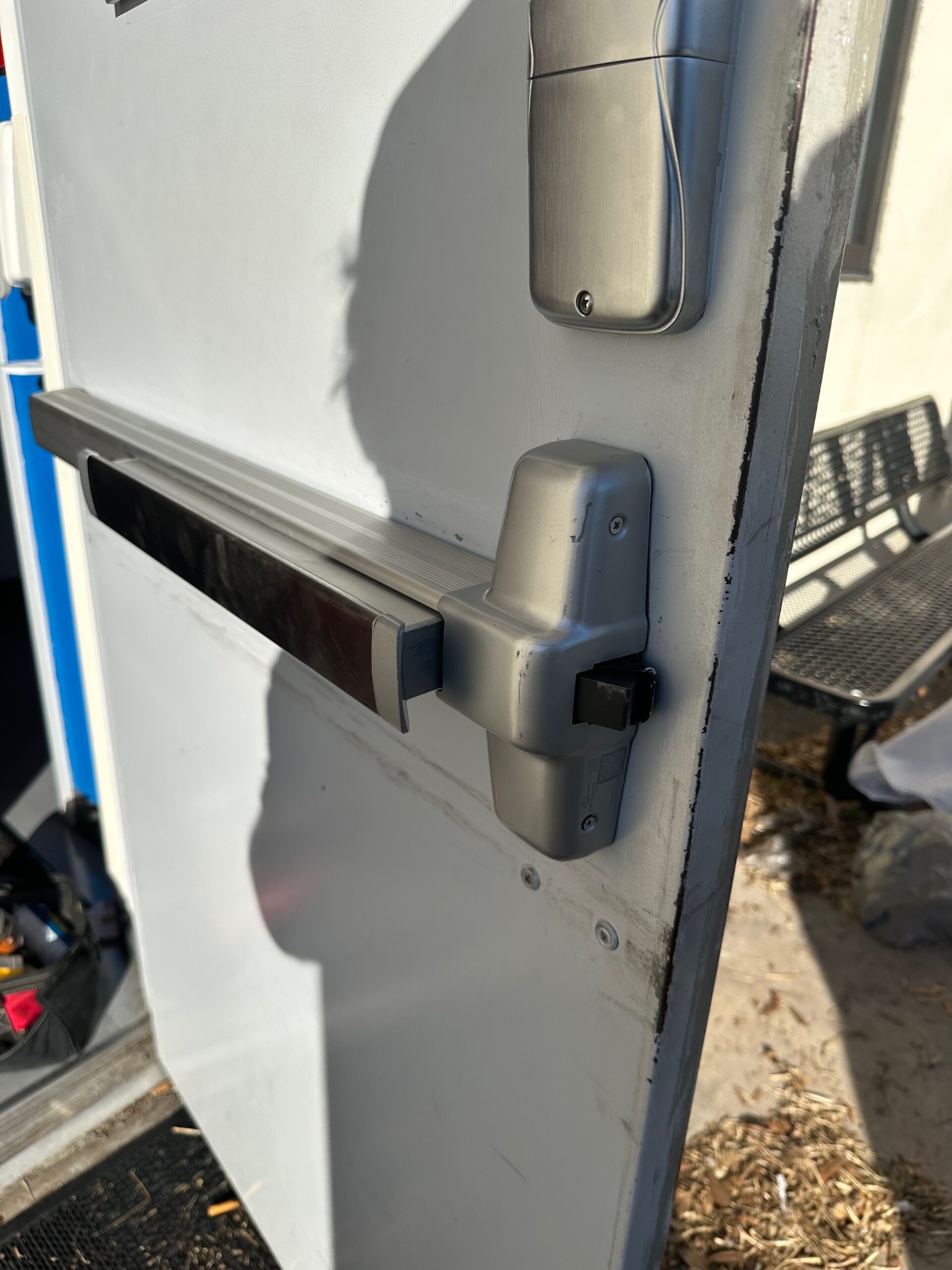 Commercial panic bar exit device installed on a Brevard County business door