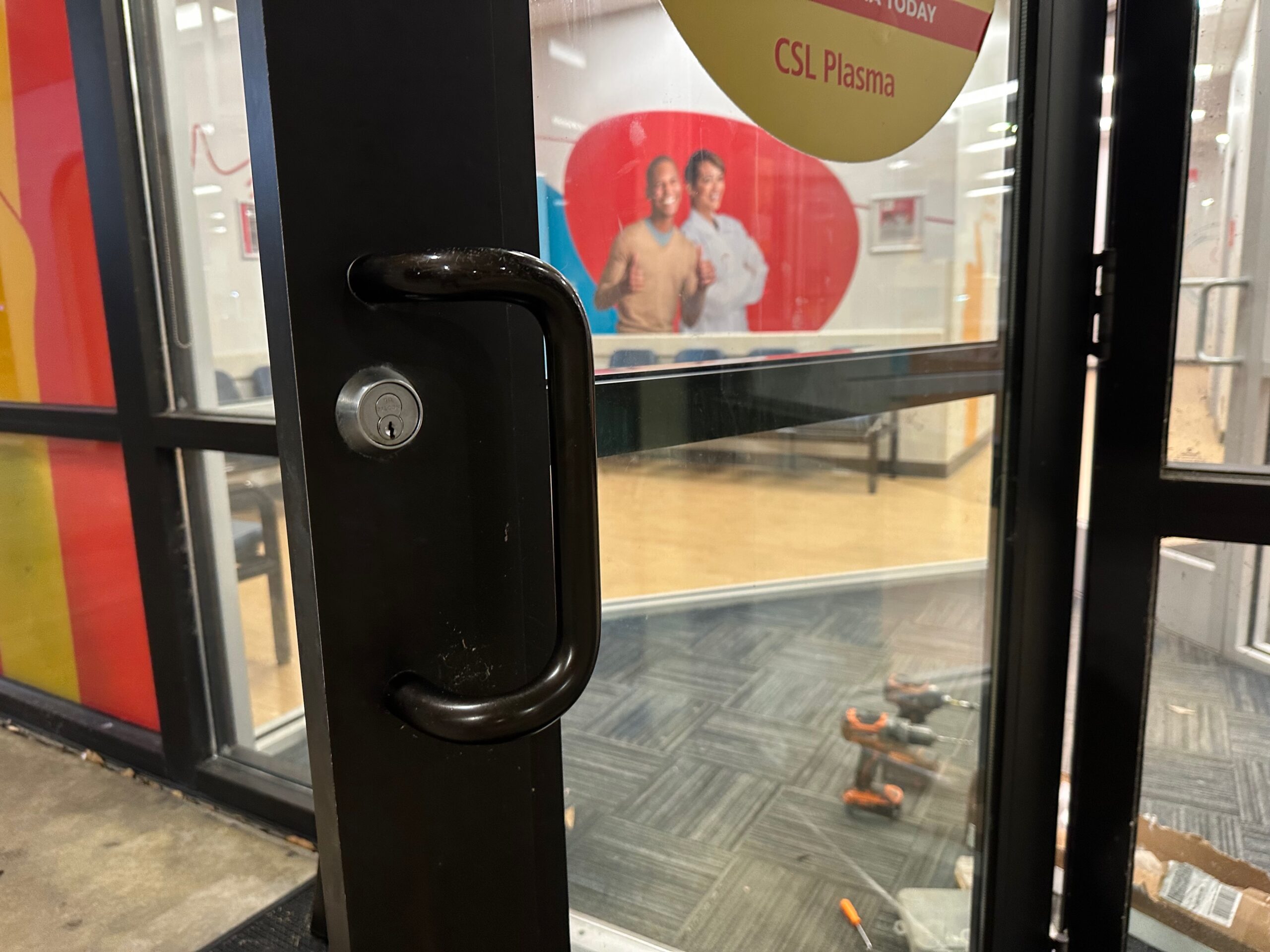 Storefront glass door lock serviced by a commercial locksmith in Melbourne FL